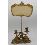AN UNUSUAL FRENCH GILT METAL ROCOCO INK STAND, EARLY 19TH CENTURY, adjustable cartouche shaped