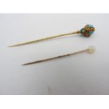 AN ORNATE TURQUOISE YELLOW METAL STICK PIN AND AN OPAL YELLOW METAL STICK PIN, (untested), late 19th