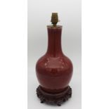 A FLAMBE GLAZED BALUSTER VASE, QING DYNASTY, 19TH CENTURY, covered in a rich copper red glaze,