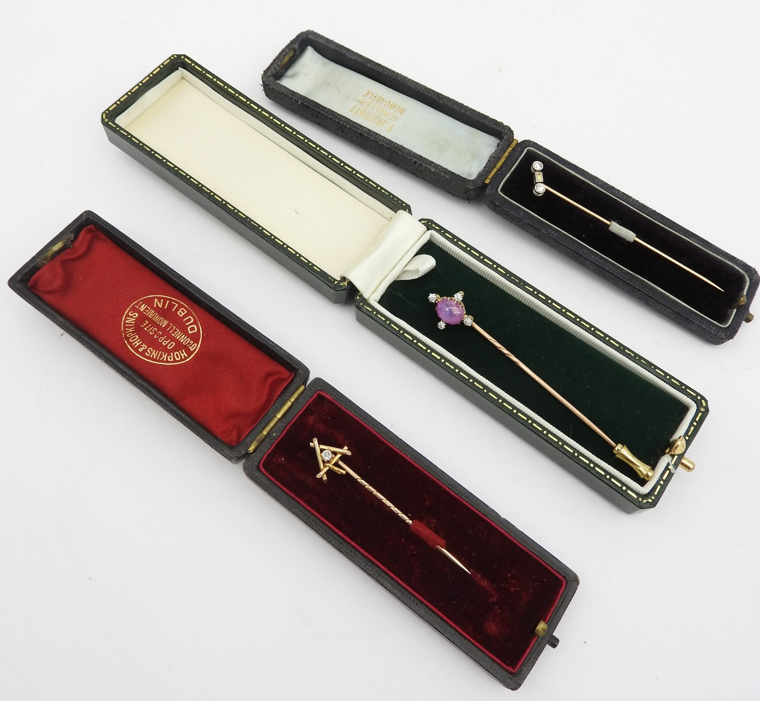 A GROUP OF THREE YELLOW METAL DIAMOND SET STICK PINS, LATE 19TH / EARLY 20TH CENTURY,  one set