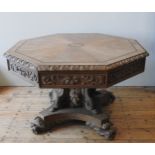 AN IMPRESSIVE 19TH CENTURY CARVED OAK OCTAGONAL CENTRE TABLE, in the Gothic Revival style, the