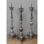 A GROUP OF THREE SILVER PLATED ALTAR CANDLE STANDS, 19TH CENTURY, knopped fluted baluster columns
