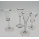 A GEORGE III CORDIAL GLASS WITH TRUMPET SHAPE BOWL,the stem with teardrop shape inclusion, another