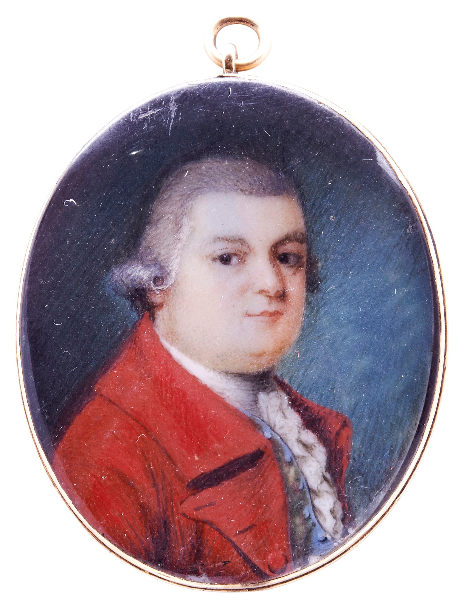 A LATE 18TH CENTURY MINIATURE OVAL PORTRAIT, ENGLISH SCHOOL, of a gentleman wearing a red frock coat