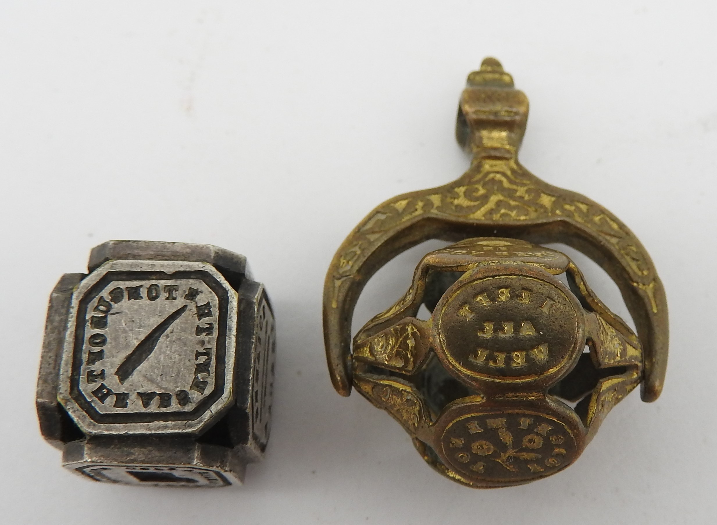 Victorian Intaglio Note AN EARLY VICTORIAN SPINNING INTAGLIO FOB SEAL AND A CUBE FORM INTAGLIO ...
