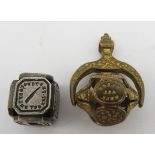 AN EARLY VICTORIAN SPINNING INTAGLIO FOB SEAL AND A CUBE FORM INTAGLIO SEAL, CIRCA 1850, the