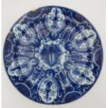 A LARGE DELFT BLUE AND WHITE PLATE, LATE 18TH / EARLY 19TH CENTURY, central reserve with fruit