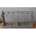 AN IMPRESSIVE VICTORIAN CAST-IRON STICK STAND, CIRCA 1880, three cruciform panels united by a