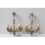 A PAIR OF ORNATE FRENCH STYLE GILT METAL CHANDELIERS, CIRCA 1935, four branch, decorated with