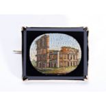A 19TH CENTURY ITALIAN MICRO MOSAIC BROOCH OF THE COLLOSSEUM, in a yellow metal mount PROVENANCE: