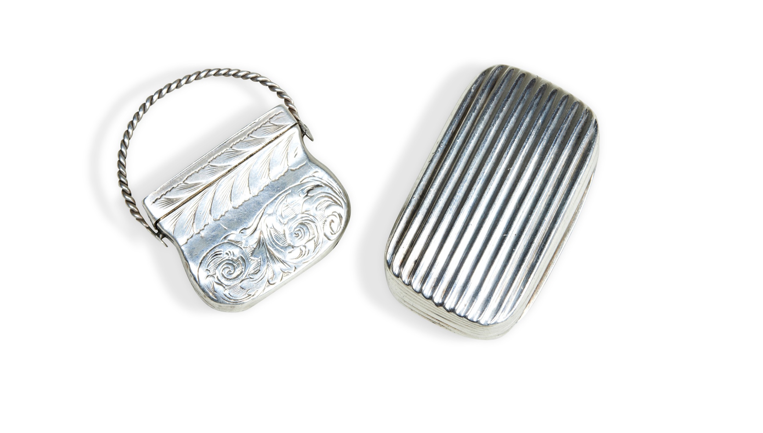 TWO EARLY 19TH CENTURY SILVER VINAIGRETTES, one rectangular ribbed form with silver gilt grille