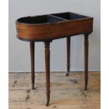 A GEORGE III MAHOGANY CUTLERY STAND, the bow front galleried top split into two compartments,