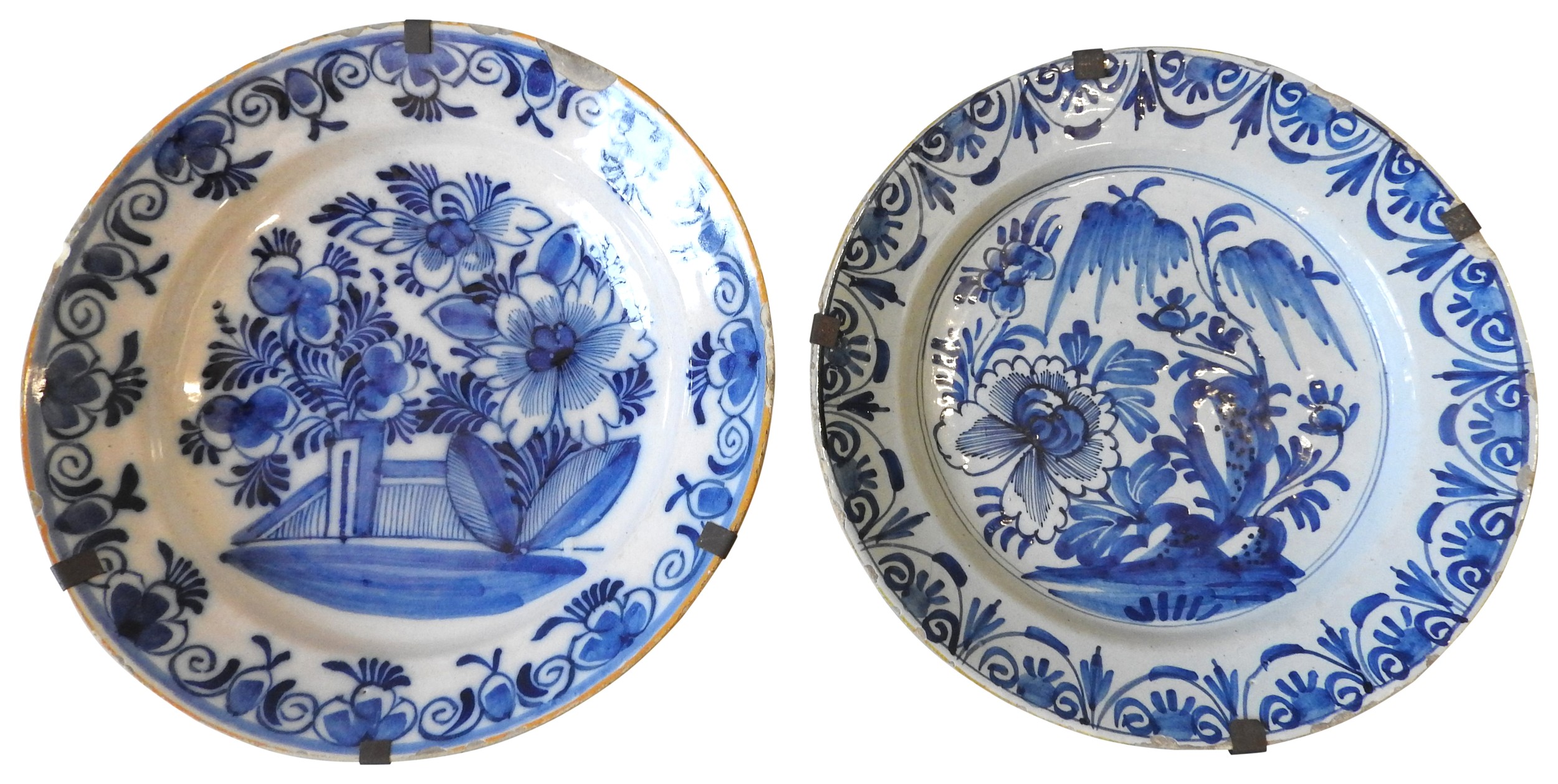 TWO LARGE BLUE & WHITE DELFT PLATES, 18TH CENTURY, both decorated with similar floral and foliate