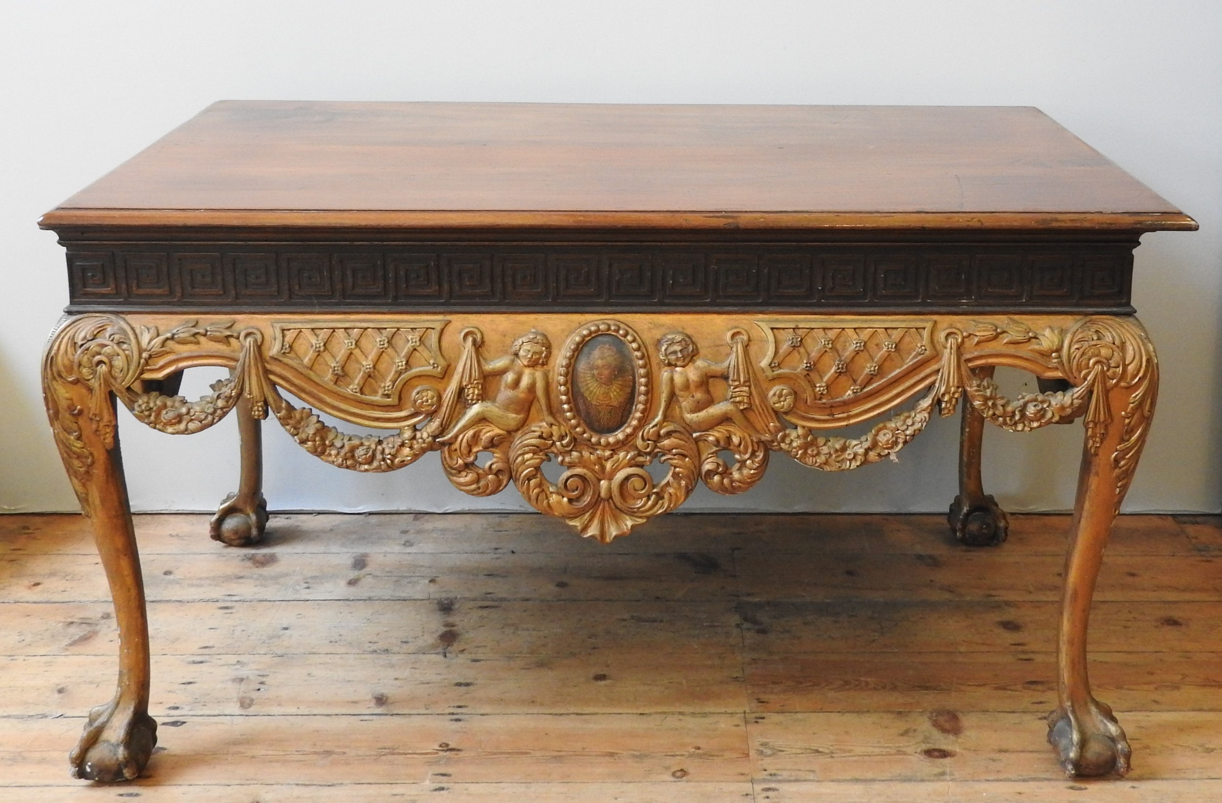 A MID 19TH CENTURY MAHOGANY AND GILT WOOD CENTRE TABLE, the shape and proportions in the Chippendale