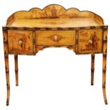 A REGENCY SIMULATED BAMBOO AND CHINOISERIE DRESSING TABLE, CIRCA 1820, the shaped three quarter