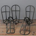 A GROUP OF FIVE CAST-IRON TACK ROOM SADDLE RACKS, 19TH CENTURY, painted green 29 x 49 cm and similar