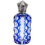 A 19TH CENTURY BOHEMIAN GLASS PERFUM BOTTLE, CIRCA 1880, blue cased facet cut form, with flared