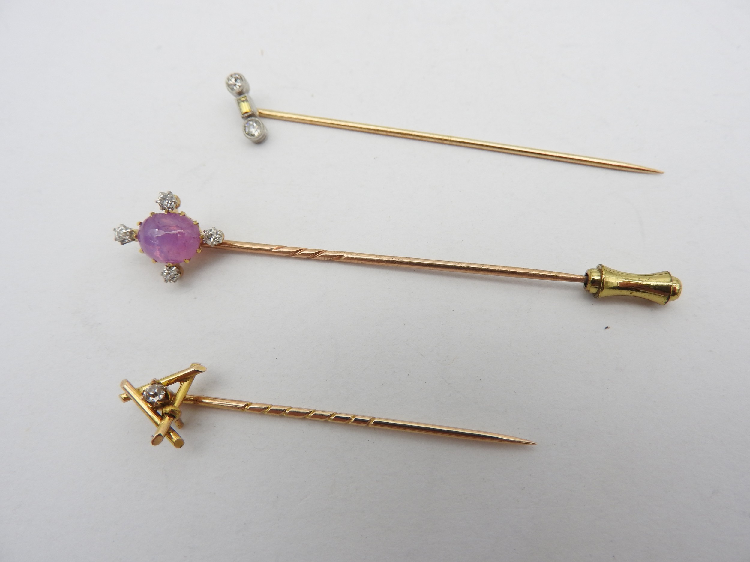 A GROUP OF THREE YELLOW METAL DIAMOND SET STICK PINS, LATE 19TH / EARLY 20TH CENTURY,  one set - Image 2 of 2