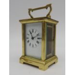 A LATE 19TH / EARLY 20TH CENTURY BRASS CARRIAGE CLOCK, of compact proportions, enamelled dial  14 cm