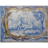 AN EARLY 19TH CENTURY TILED PANEL, depicting a noble man with hunting hound, about to strike a white