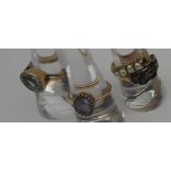 TWO GOLD GEM STONE SET RINGS AND TWO YELLOW METAL RINGS, the two gold rings stamped 9ct gold, the