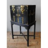 A 19TH CENTURY BRASS BOUND FALL FRONT CABINET, the ebonised cabinet with heavy duty brass