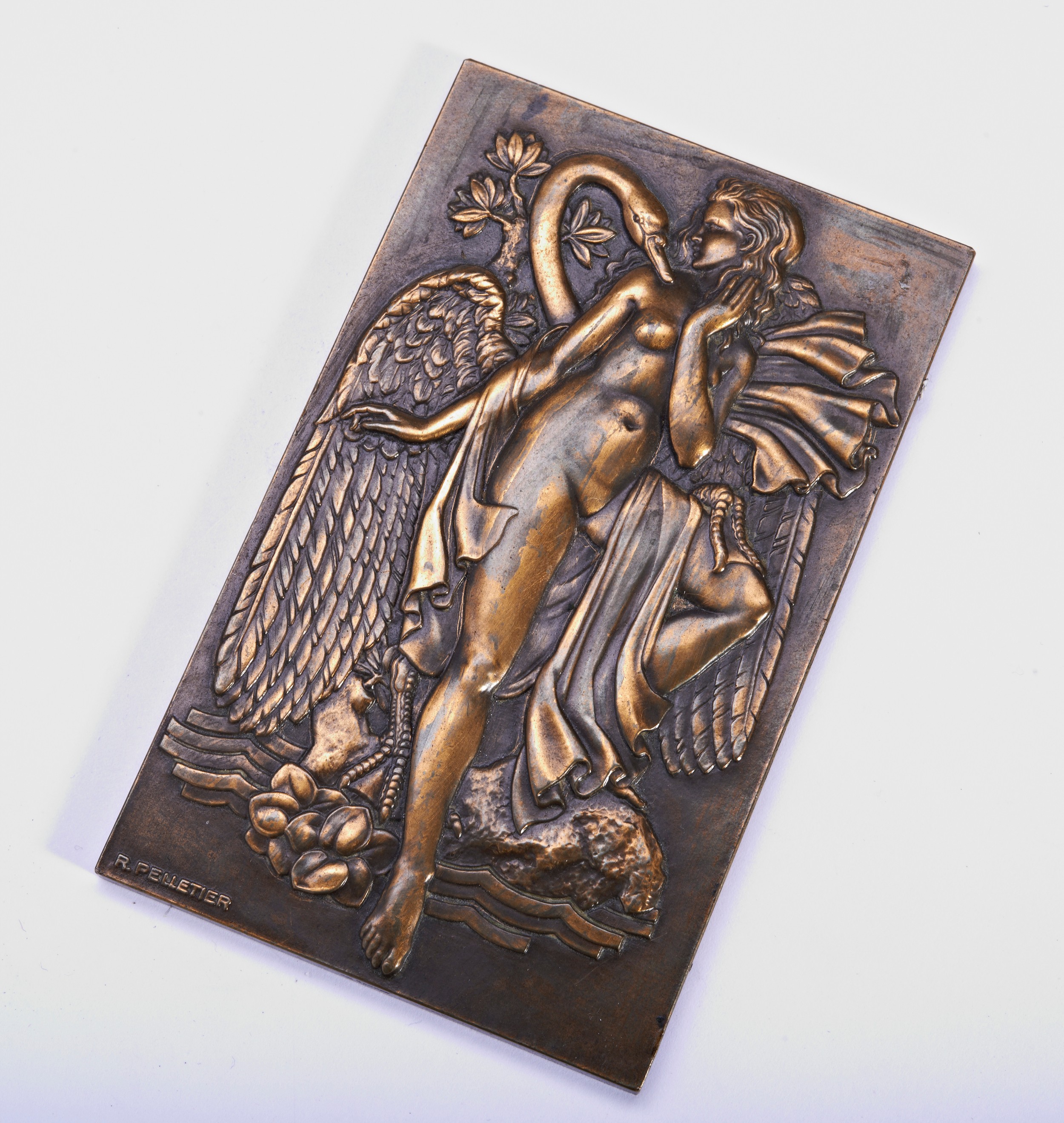 R. PELLETIER, LÉDA ET LE CYGNE, bronze plaque, signed. 10 x 6.2 cms. PROVENANCE: The Dr. Christopher