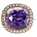 AN AMETHYST AND PEARL BROOCH, CIRCA 1870 the cushion-cut amethyst, collet set within a border of