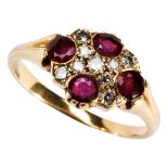 A LATE VICTORIAN RUBY AND DIAMOND CLUSTER RING set with four circular mixed-cut rubies and eight