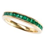 AN EMERALD AND GOLD HALF HOOP ETERNITY RING channel set with fifteen step-cut emeralds in plain gold