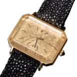 OMEGA; A RARE 18CT GOLD "EMERALD" WRISTWATCH BY ANDREW GRIMA signed "florally" embosed dial with