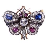 A VICTORIAN GOLD DIAMOND, RUBY AND SAPPHIRE SET BUTTERFLY BROOCH, CIRCA 1870 the body set with an