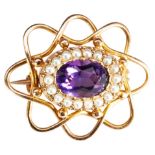 A LATE VICTORIAN AMETHYST AND SEED PEARL BROOCH, CIRCA 1890 the oval faceted amethyst in a border of