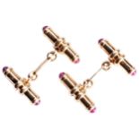 A PAIR OF 18CT GOLD AND RUBY CUFFLINKS the barrel cufflinks, each set with two cabochon-cut