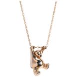 A 9 CARAT GOLD BEAR PENDANT swinging from a fancy link chain. Hallmarked for 9 carat gold Total