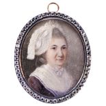 A HAND PAINTED GEORGIAN PORTRAIT PANEL PENDANT the oval plaque depiciting an older lady with lace