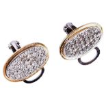 A PAIR OF DIAMOND EARCLIPS the oval discs pave set with eight-cut diamonds, in two colour mount.