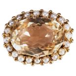 A CITRINE AND PEARL BROOCH, CIRCA 1880 the oval mixed-cut citrine claw and collet set within a