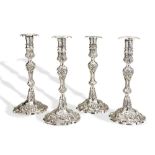 A MATCHED SET OF FOUR ROCOCO CANDLESTICKS, DUBLIN C.1760. Two matched pairs of cast Irish rococo