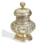 A SILVER GILT JAR FOR CAVIAR MADE BY FABERGÉ. The lid lifts to reveal a glass insert which sits