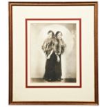 DAISY & VIOLET HILTON, A SIGNED PHOTOGRAPH OF THE CONJOINED TWINS wearing fox stoles, the