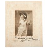 HARRIETT VERNON, A SIGNED PHOTOGRAPH, POSED IN 18TH CENTURY STYLE DRESS, the inscription in ink ‘