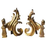 A PAIR OF GILT BRASS SCROLL FOLIATE CHENETS, LATE 19TH CENTURY, Acanthus leaf form, on fluted column