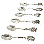 A SET OF SIX SILVER TEASPOONS, each with highly ornate floral and fruit decorated pierced handles,