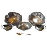 A PAIR OF SILVER SWEET MEAT DISHES AND A PAIR OF SILVER SALT CELLARS, the pair of cartouche form
