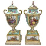 A PAIR OF HAND PAINTED DRESDEN COVERED URNS, LATE 19TH CENTURY, Grecian form with scrolling handles,
