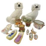 A PAIR OF STAFFORDSHIRE DOGS, A 19TH CERAMIC COT FIGURE, TWO OTHERS, TWO PASTILLE BURNERS AND