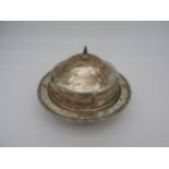 A SILVER MUFFIN DISH AND COVER, circular form with cushion domed cover, marked Sheffield 1921 18