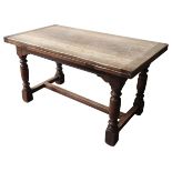 A CARVED OAK DRAW LEAF REFECTORY TABLE, EARLY 20TH CENTURY, rectangular top with two pull-out