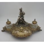 A 19TH CENTURY SILVER PLATED INK STAND, the ornate shell decorated rocaille stand surmounted by